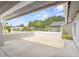 This patio has a serene backyard view featuring clear skies and mature trees, perfect for outdoor relaxation at 8499 101St Ave, Seminole, FL 33777