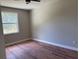 Cozy bedroom featuring a window and laminate flooring at 904 Grand Canyon Dr, Valrico, FL 33594