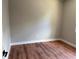 A bedroom with light grey walls and dark laminate floors at 904 Grand Canyon Dr, Valrico, FL 33594