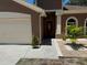Inviting home exterior with a well-manicured garden and a classic front door at 904 Grand Canyon Dr, Valrico, FL 33594