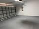 Spacious two-car garage with an epoxy floor and new garage door at 904 Grand Canyon Dr, Valrico, FL 33594
