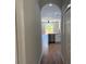 Hallway that looks into a modern kitchen and living space at 904 Grand Canyon Dr, Valrico, FL 33594