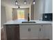 Modern kitchen featuring new cabinets, quartz counters, and a stainless steel dishwasher at 904 Grand Canyon Dr, Valrico, FL 33594