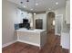 Modern kitchen featuring an island, stainless steel appliances, and pendant lights at 904 Grand Canyon Dr, Valrico, FL 33594