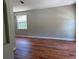 Bright living room with hardwood floors and a large window at 904 Grand Canyon Dr, Valrico, FL 33594