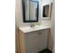 Bathroom features include white vanity, framed mirror and a tiled floor at 13829 Mission Oaks Blvd, Seminole, FL 33776