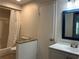 Clean bathroom featuring a shower/tub, tiled floors, and a granite-topped vanity at 13829 Mission Oaks Blvd, Seminole, FL 33776