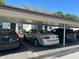 Carport showing multiple covered parking spots to protect vehicles from the elements at 13829 Mission Oaks Blvd, Seminole, FL 33776