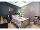 Nicely appointed bedroom with gray tones and a unique headboard design at 11711 Winterset Cove Dr, Riverview, FL 33579