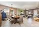 Spacious living room with tiled floors and open floor plan to dining area at 11711 Winterset Cove Dr, Riverview, FL 33579