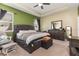 Inviting main bedroom with tray ceiling and neutral colors provide a relaxing retreat at 11711 Winterset Cove Dr, Riverview, FL 33579