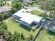 A beautiful home with a manicured lawn, outdoor decks, a hot tub, and perimeter fencing at 120 Crestwood Ln, Largo, FL 33770