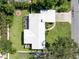 Overhead backyard aerial view featuring a large yard, patio, and landscaping at 120 Crestwood Ln, Largo, FL 33770