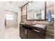 Unique bathroom with a stone sink, wood accents, and a modern walk-in shower at 120 Crestwood Ln, Largo, FL 33770