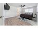 Spacious bedroom with wood floors, a large area rug, and serene natural lighting at 120 Crestwood Ln, Largo, FL 33770