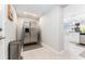The pantry features a stainless steel refrigerator with a water dispenser and adjacent access to the kitchen at 120 Crestwood Ln, Largo, FL 33770