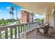 Relaxing balcony space with seating, overlooking city views and palm trees at 1200 N Shore Ne Dr # 404, St Petersburg, FL 33701