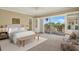 Bright bedroom featuring light-colored furniture, carpet, built-ins and sliding doors to a balcony at 1200 N Shore Ne Dr # 404, St Petersburg, FL 33701