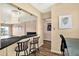 Open kitchen area with bar seating, connecting to a dining and living area at 1200 N Shore Ne Dr # 404, St Petersburg, FL 33701