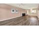 This living room features hard floors, wall decor, and a chandelier above the kitchen breakfast bar at 1200 N Shore Ne Dr # 404, St Petersburg, FL 33701
