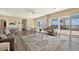 Spacious living room area with sliding glass doors to a balcony and beautiful water views at 1200 N Shore Ne Dr # 404, St Petersburg, FL 33701