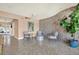 Inviting lobby area with stone accent wall, seating, a tropical plant, and terrazzo flooring at 1200 N Shore Ne Dr # 404, St Petersburg, FL 33701