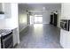 Spacious living room boasting tile flooring with adjacent open kitchen concept at 1200 Tarpon Woods Blvd # M6, Palm Harbor, FL 34685