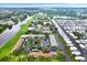 Beautiful aerial view of the community with lush green landscaping and a tranquil lake at 1206 10Th Se Cir, Largo, FL 33771