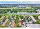 Aerial view of community and surrounding lake at 1206 10Th Se Cir, Largo, FL 33771
