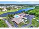 Overhead view showcasing the community clubhouse, pool, and tennis courts, ideal for recreation at 1206 10Th Se Cir, Largo, FL 33771