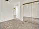 This bedroom offers carpet flooring and a mirrored closet at 1206 10Th Se Cir, Largo, FL 33771