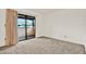 This bedroom has carpet, a sliding glass door to patio at 1206 10Th Se Cir, Largo, FL 33771