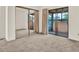 This bedroom offers carpet flooring, closet and door to patio at 1206 10Th Se Cir, Largo, FL 33771