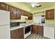 Cozy kitchen with ample counter space and crisp white appliances at 1206 10Th Se Cir, Largo, FL 33771