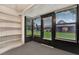 This sunroom offers large windows and shelves at 1206 10Th Se Cir, Largo, FL 33771