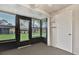 This sunroom offers large windows and shelves at 1206 10Th Se Cir, Largo, FL 33771