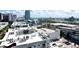 Beautiful aerial view of condo complex with parking garage and distant harbor at 1209 E Cumberland Ave # 1003, Tampa, FL 33602