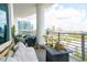 Relaxing balcony with comfortable seating and stunning city views offers a tranquil retreat at 1209 E Cumberland Ave # 1003, Tampa, FL 33602