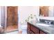 Bathroom featuring a glass-enclosed shower with tiled walls and floors at 1209 E Cumberland Ave # 1003, Tampa, FL 33602