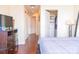 Bedroom featuring hardwood floors, closet with built-ins, and modern decor at 1209 E Cumberland Ave # 1003, Tampa, FL 33602