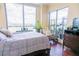 Bedroom with hardwood floors, a large window, and modern decor at 1209 E Cumberland Ave # 1003, Tampa, FL 33602