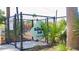 Community dog park enclosed with secure fencing and shade trees at 1209 E Cumberland Ave # 1003, Tampa, FL 33602