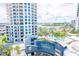 Close aerial view of white high-rise towers with private balconies and a beautiful pool area at 1209 E Cumberland Ave # 1003, Tampa, FL 33602