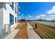 Exterior shot of a walkway near the building and blue sky at 1209 E Cumberland Ave # 1003, Tampa, FL 33602