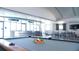 Bright game room features a pool table and bar area with ample seating and natural light at 1209 E Cumberland Ave # 1003, Tampa, FL 33602