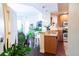Open kitchen with stainless steel appliances, granite counters, and a view of the living area at 1209 E Cumberland Ave # 1003, Tampa, FL 33602