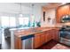 Kitchen featuring stainless steel appliances, granite countertops, and an open view to the living room at 1209 E Cumberland Ave # 1003, Tampa, FL 33602