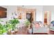 Bright living room featuring hardwood floors, comfortable seating, and a view into the adjacent kitchen at 1209 E Cumberland Ave # 1003, Tampa, FL 33602
