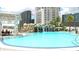 Resort-style pool featuring a rock waterfall and lounge seating at 1209 E Cumberland Ave # 1003, Tampa, FL 33602