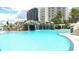 Resort-style pool featuring a rock waterfall and lounge seating at 1209 E Cumberland Ave # 1003, Tampa, FL 33602